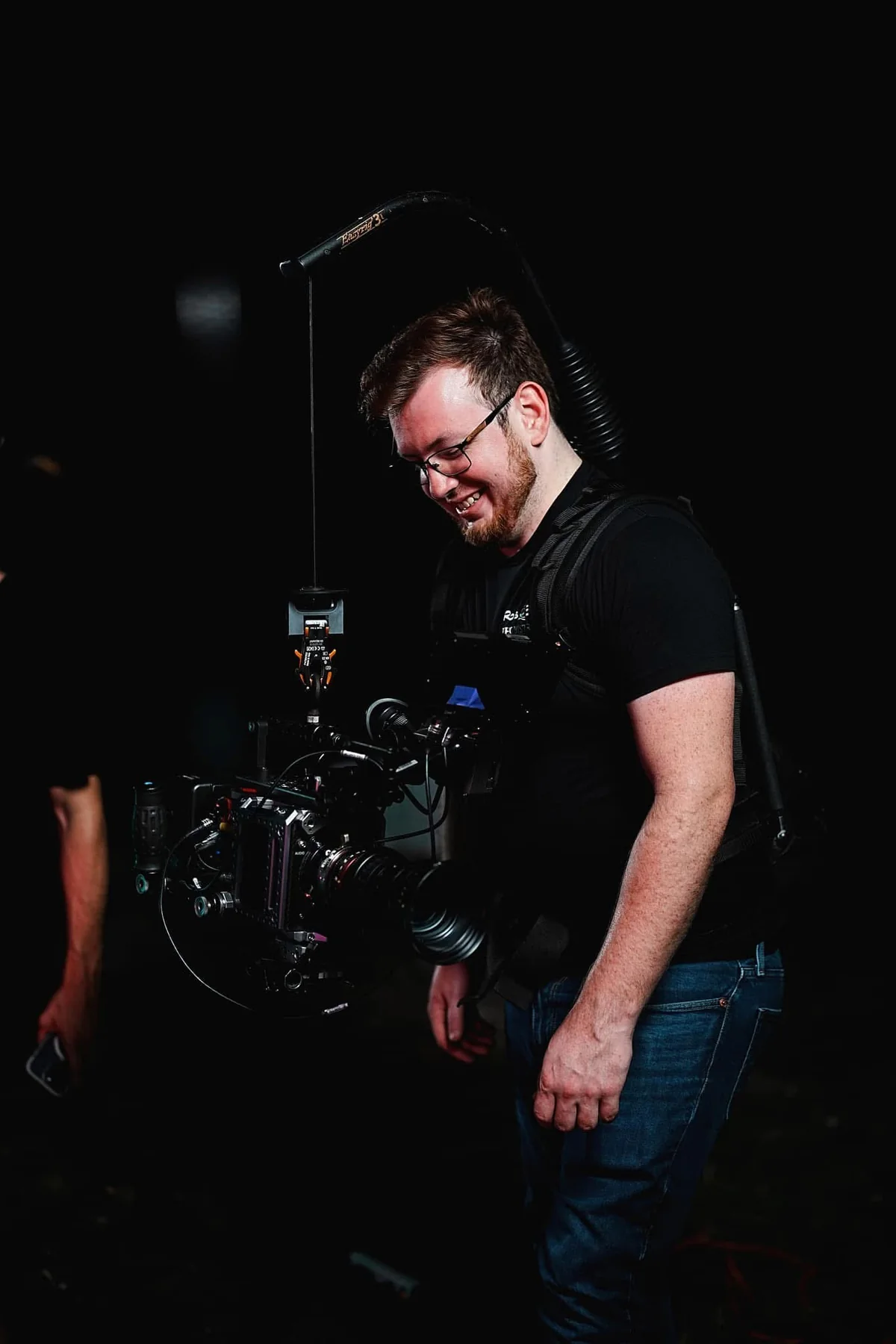 Hunter Thomas working with a cinema camera rig on set